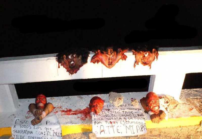 Los Zetas Display of Flayed Faces and Body Parts on Bridge Cartel Social Me...
